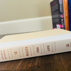 Hardcover copy of 12 Rules For Life by Jordan Peterson. No sleeve.